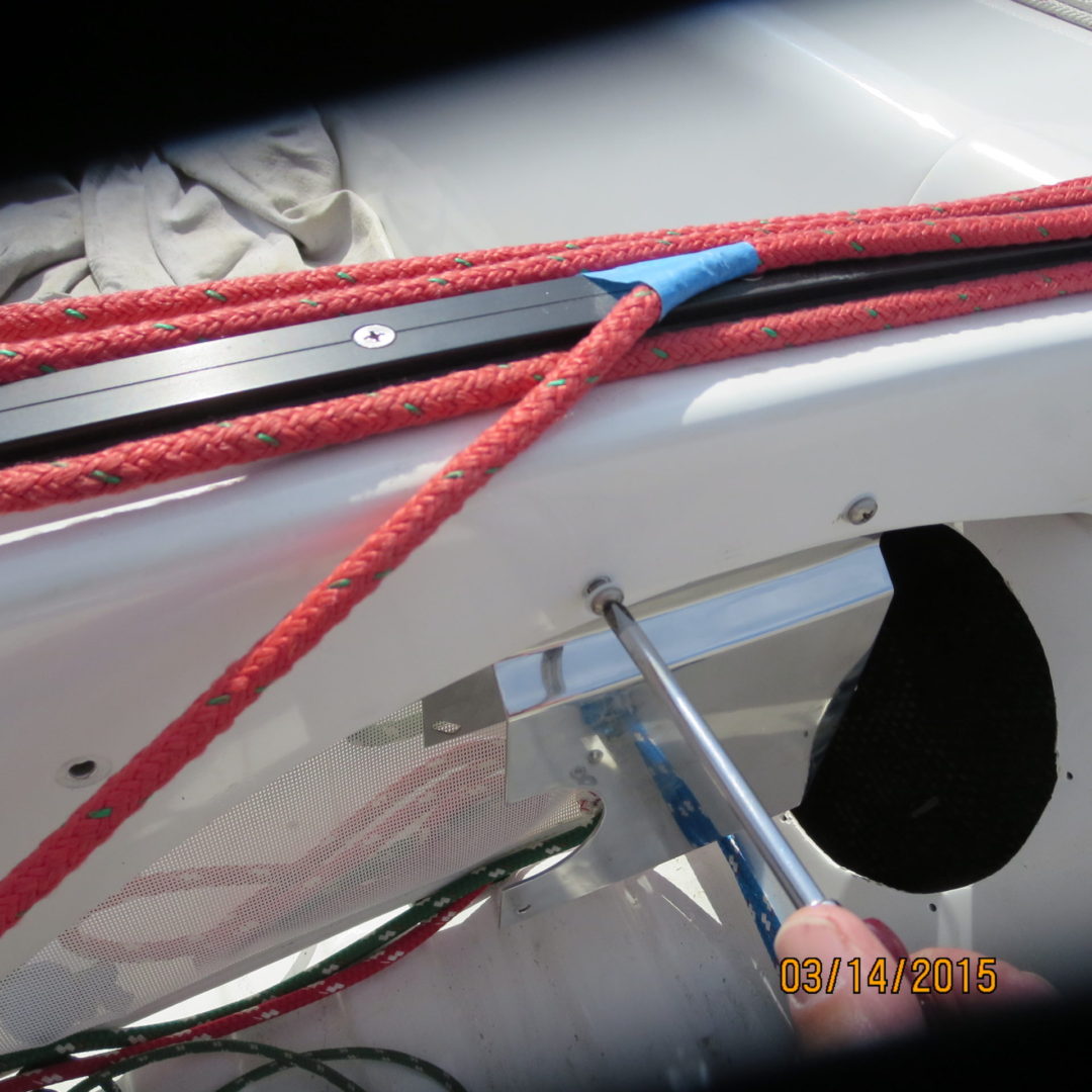 A person is holding a pair of red ropes