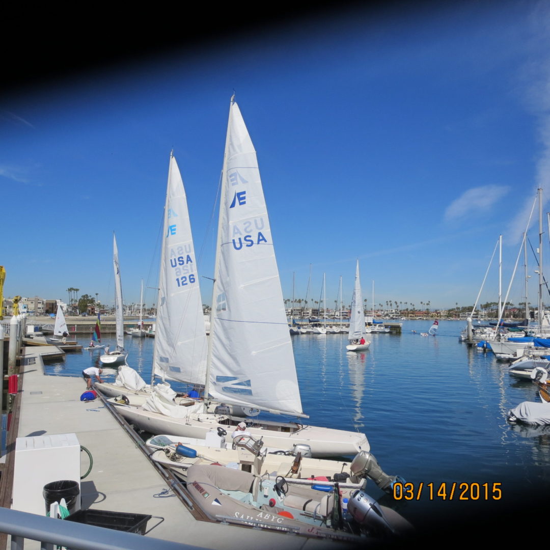 A group of sail boats in the water.