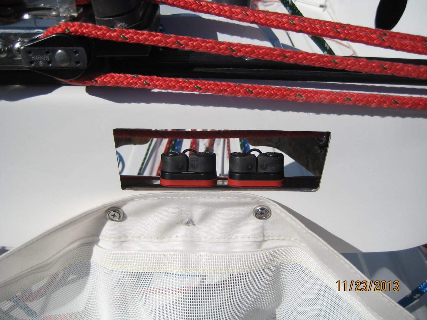 A view of the bottom of a boat with red ropes.