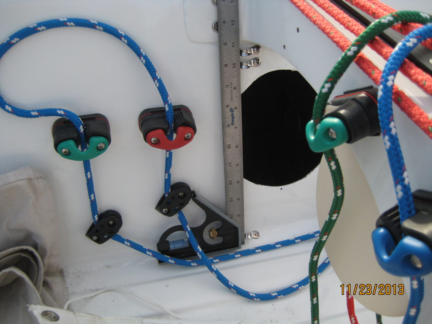 A close up of wires and cords on the side of a boat.