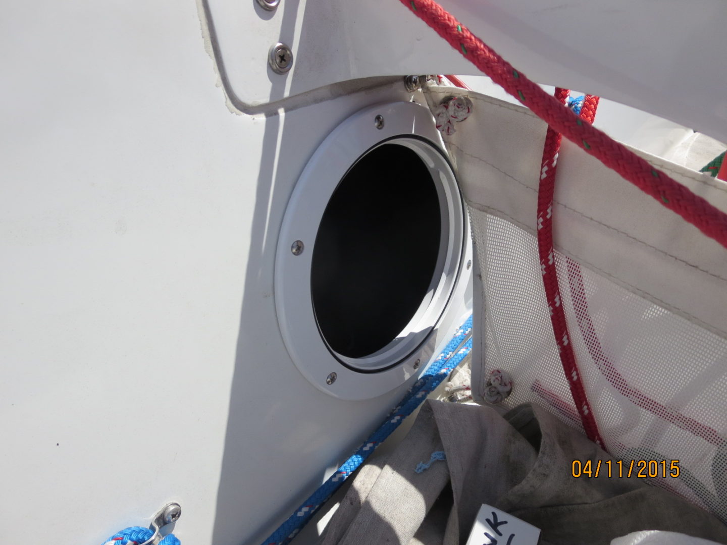 A close up of the porthole on a boat.