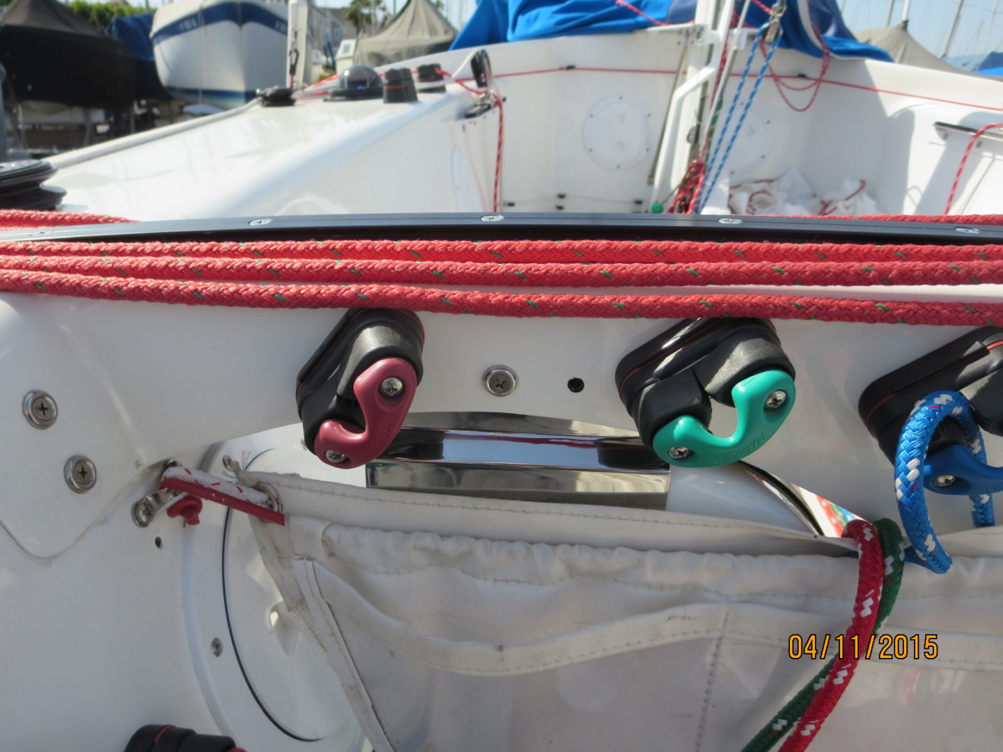 A boat with two red ropes on the deck.