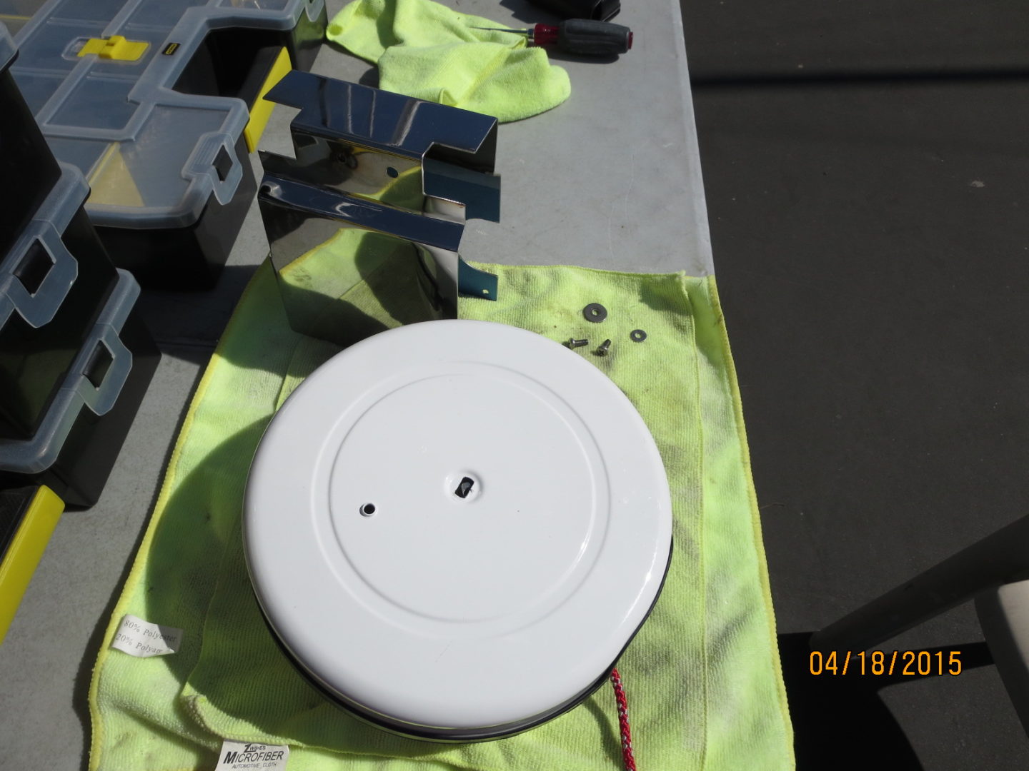 A white plate sitting on top of a yellow cloth.