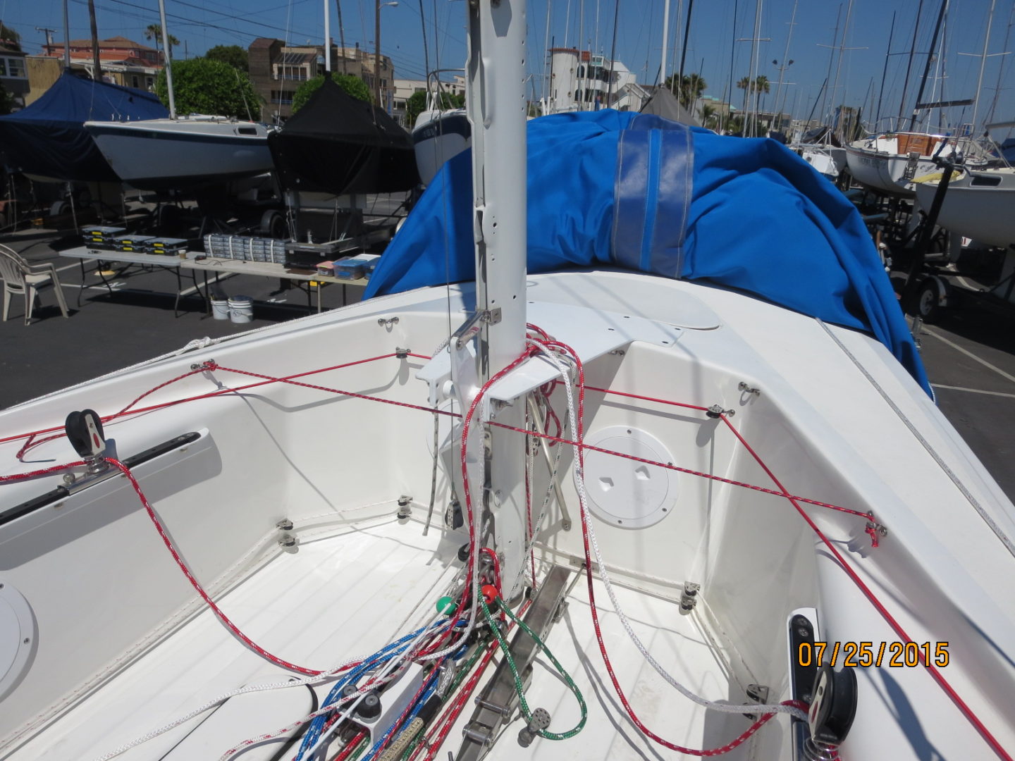 A boat with wires hanging from the side of it.