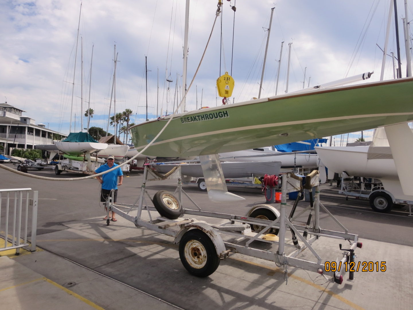 A boat is being loaded on the trailer.