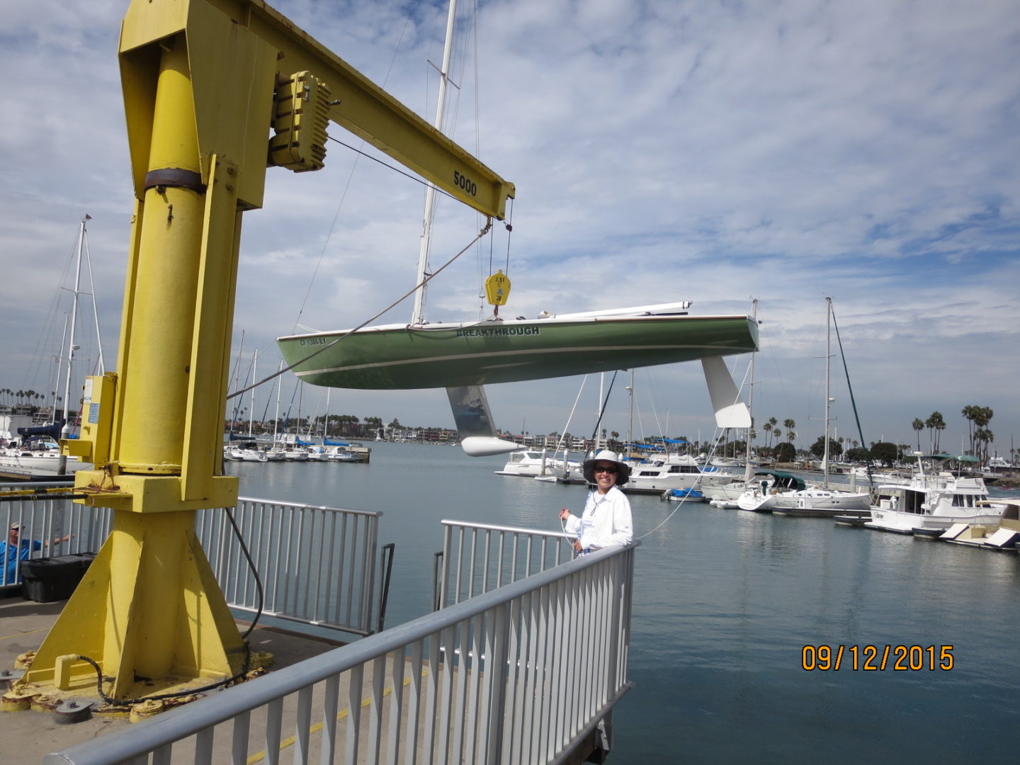 A man standing on the side of a boat.