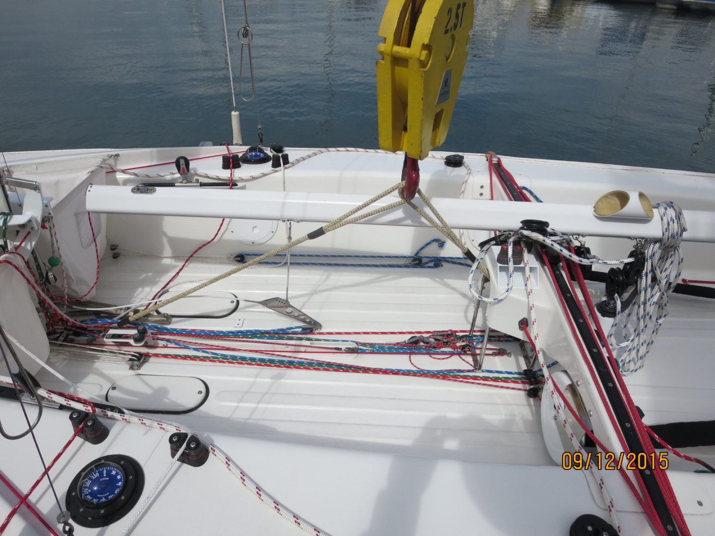 A boat with many ropes on the deck