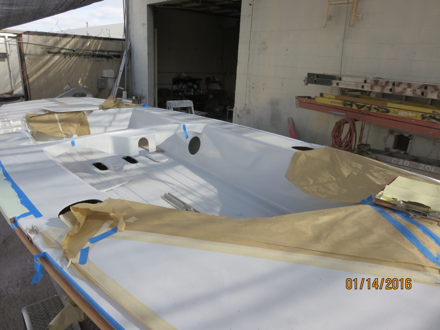 A boat is being painted and ready for painting.