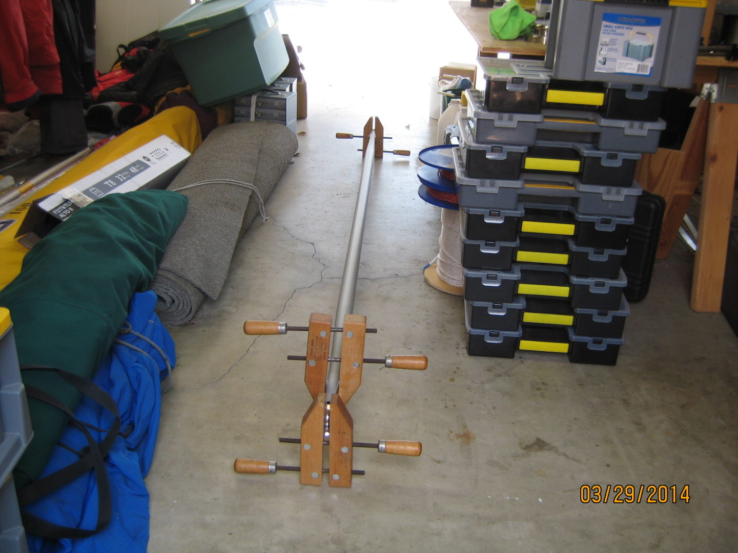 A couple of wooden pegs in the middle of a room.