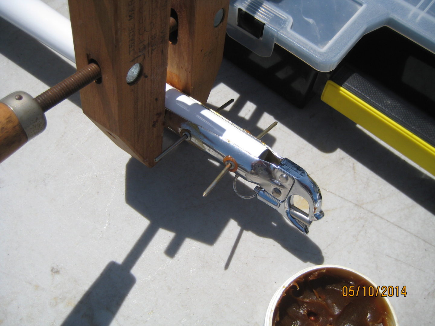 A boat is sitting on the dock and has a bowl of food.