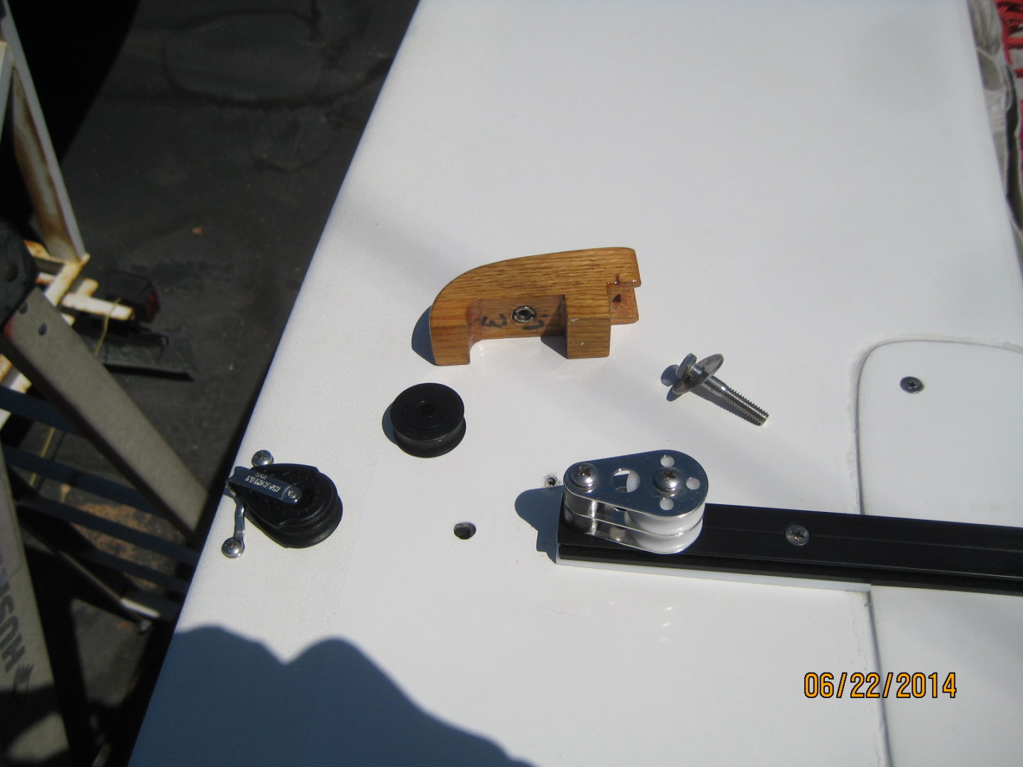 A close up of some tools on top of a boat.