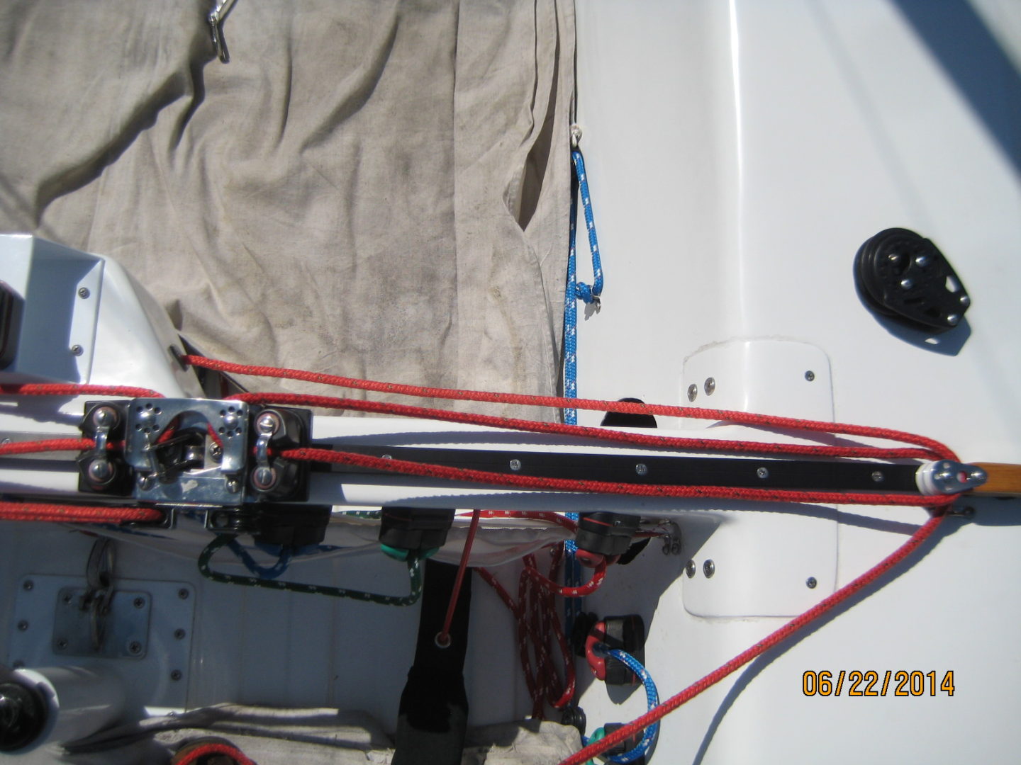 A boat with red and white ropes on the side of it.