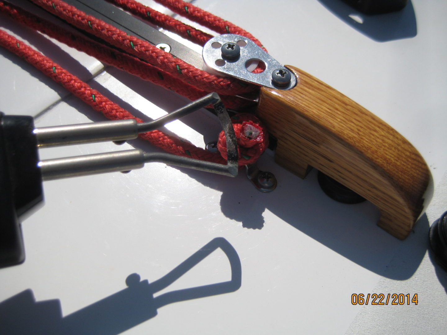 A pair of scissors and some ropes on the deck.