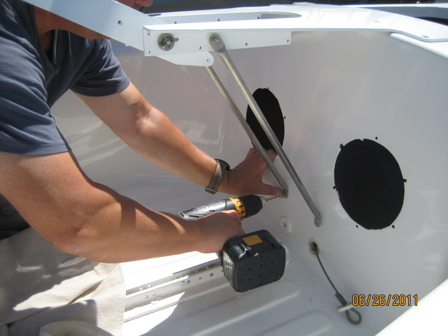 A man working on the side of a boat.