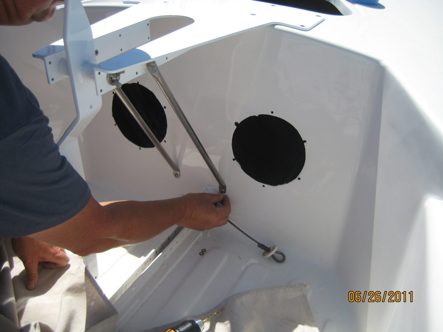 A man working on the side of a boat.