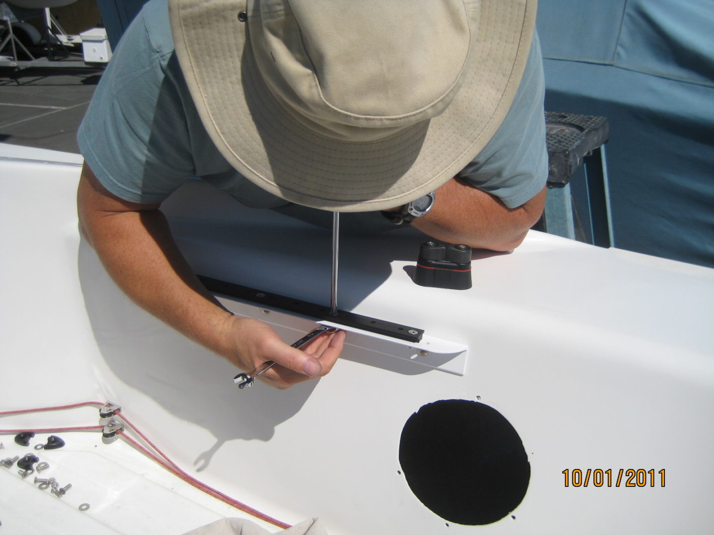 A man in a hat is sitting on the boat