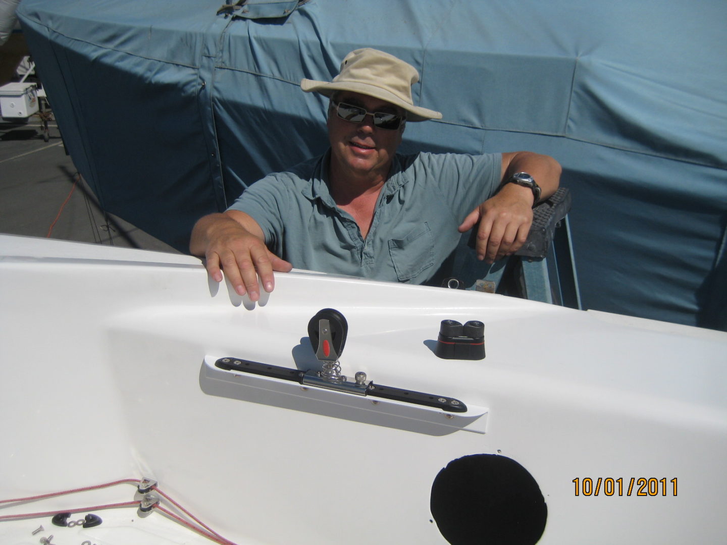 A man sitting on top of a boat.