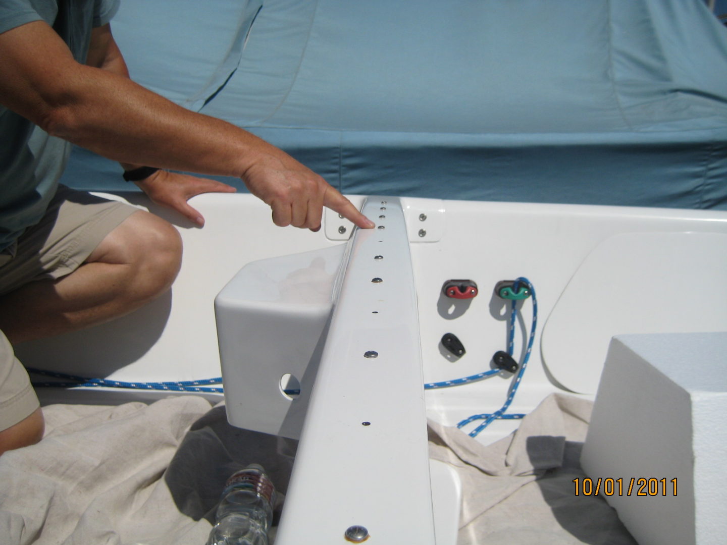 A man working on the side of a boat.