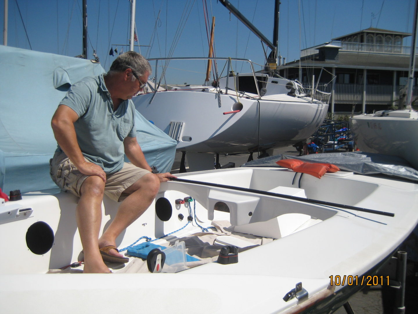 A man standing on the side of a boat.