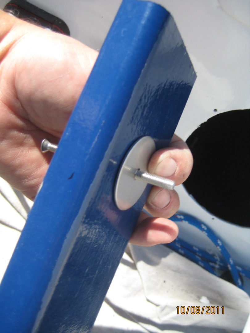 A person holding onto the end of a blue object.