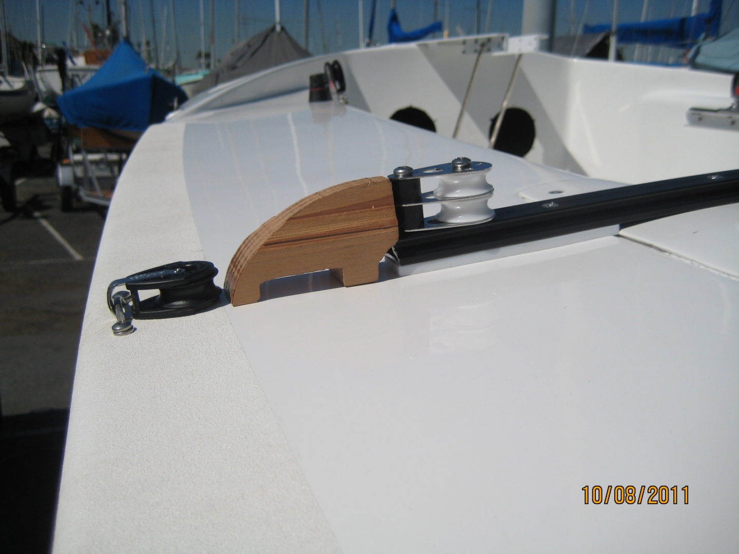 A boat with a wooden handle on the side.