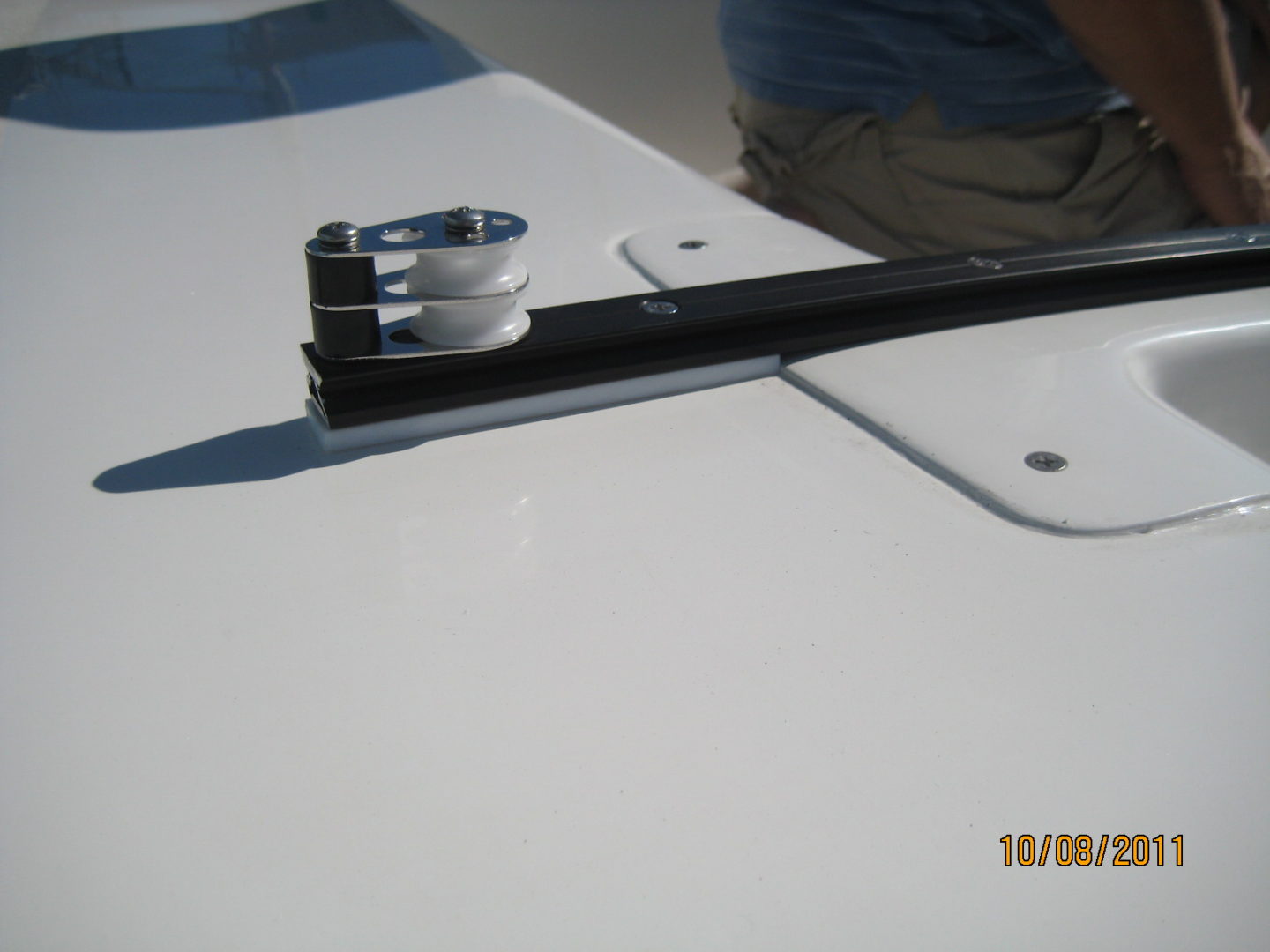 A white table with a black and silver metal object.