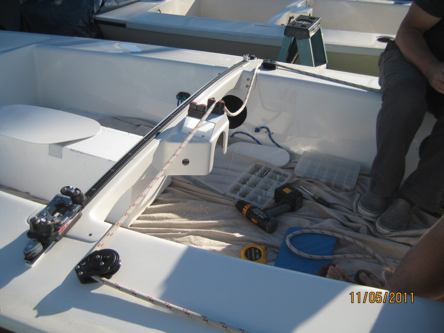 A man standing on top of a boat.