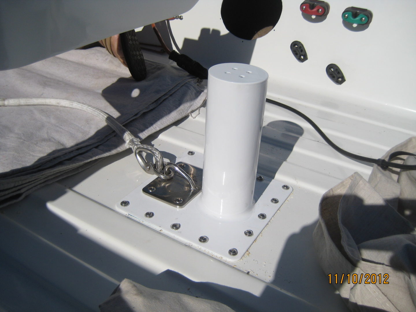 A white pole sitting on top of a boat.