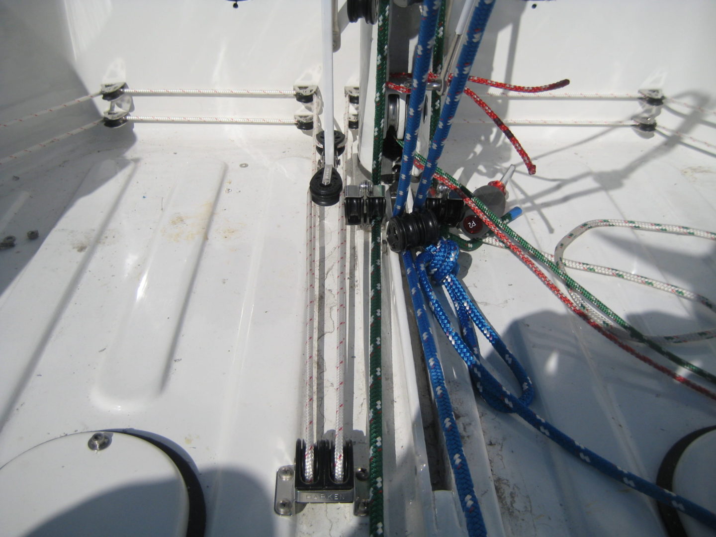 A close up of ropes on the side of a boat.