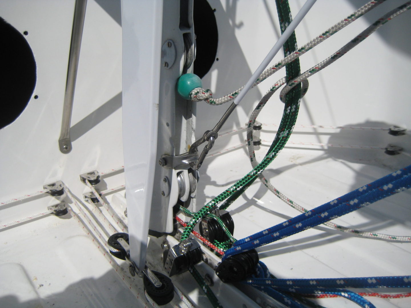 A close up of wires and cables on the side of a boat.