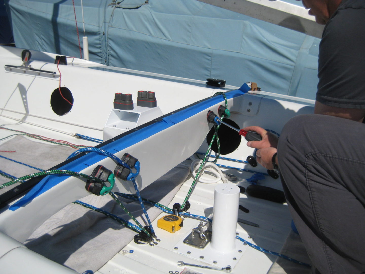 A man working on the side of a boat.