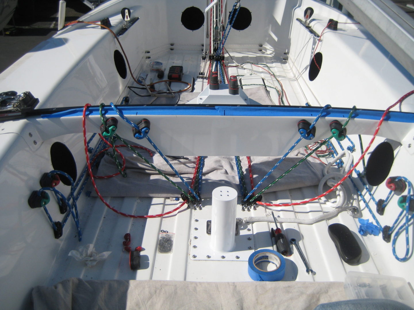 A boat with many wires and some electrical equipment.