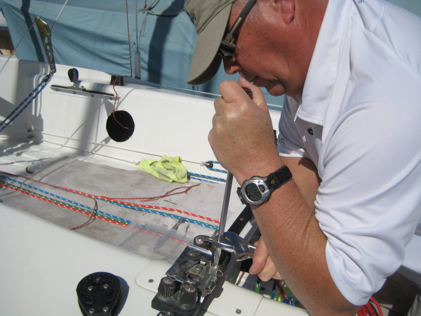 A man working on the side of a boat.